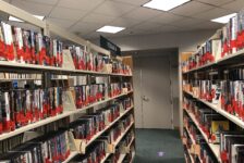 Giovale rentals on shelves in the library.